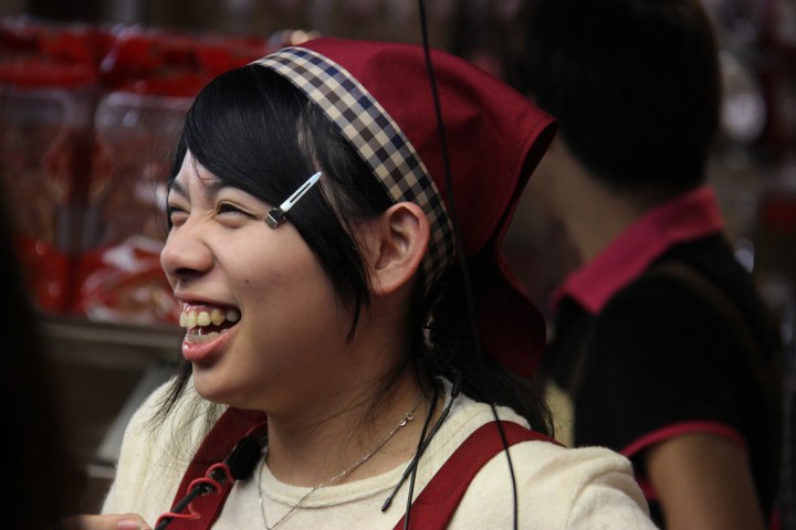 A giggling Taipei night market vendor.