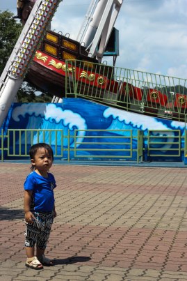 The saddest (and only) boy at the amusement park.